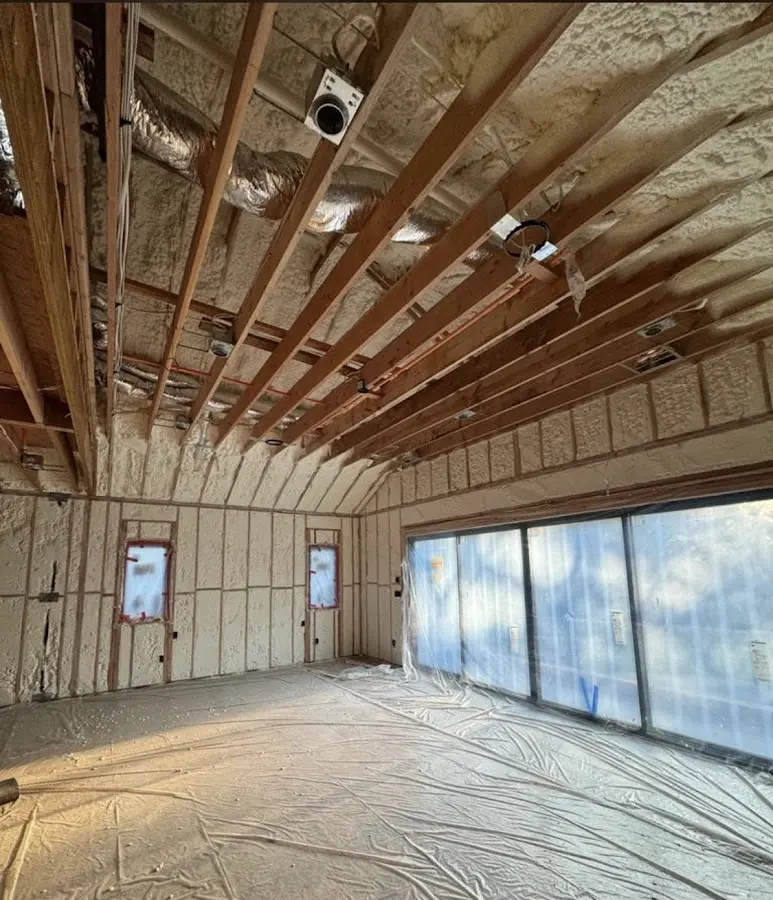 Interior walls and ceiling insulated with spray foam during new construction in Burke Centre